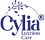 The logo for Cylia Luxrious Care, featuring the brand name in dark blue serif lettering with a decorative leafy branch arching over the wordmark, set against a transparent checkered background.